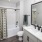 A bathroom with a white shower