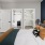 Bedroom with natural lighting and high ceilings