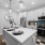 Enjoy bright, modern cabinetry and spacious countertops—perfect for sipping wine at the bar or hosting a formal dinner.